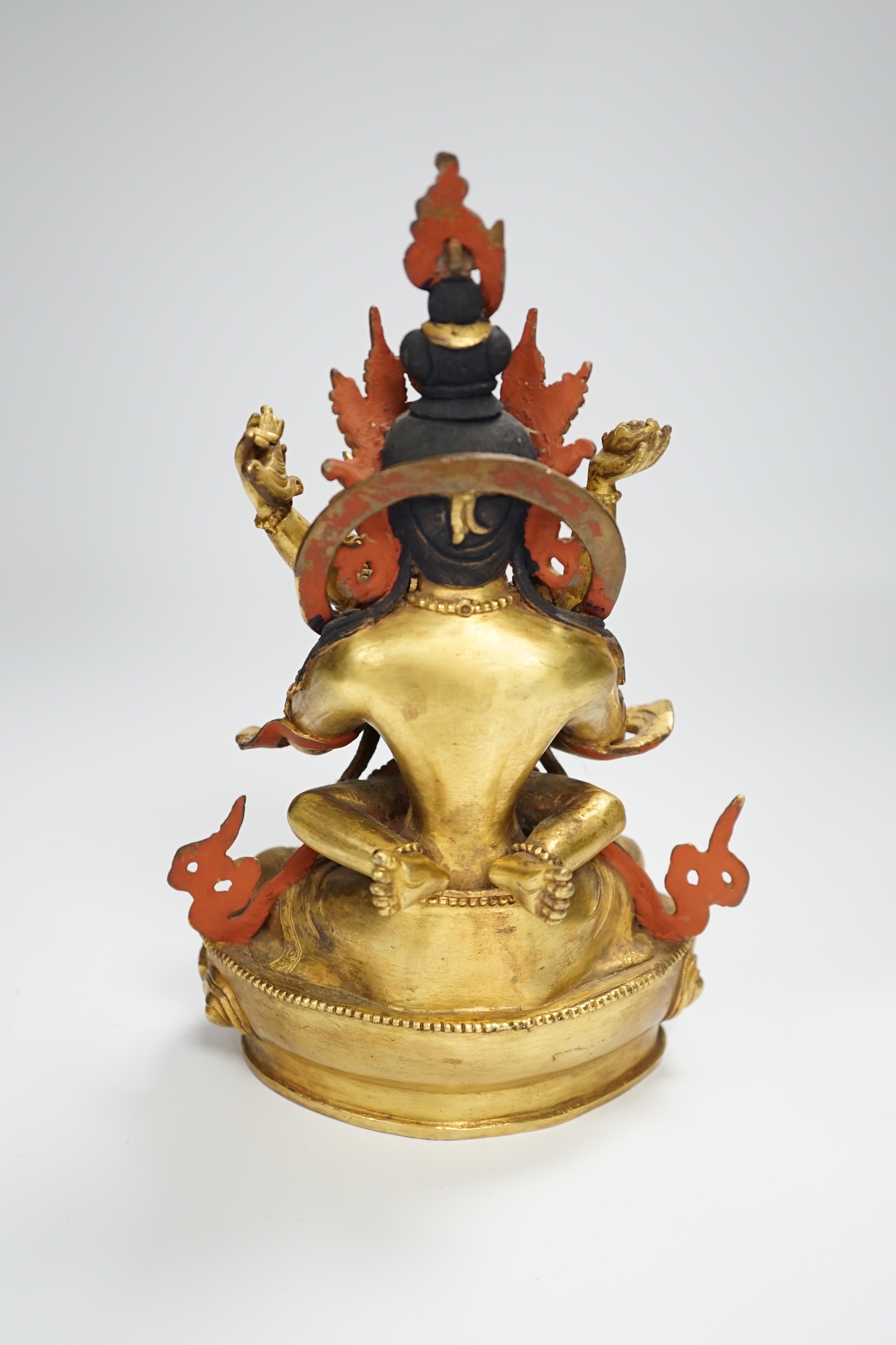 A Sino Tibetan gilt bronze group of a deity with consort, 22.5cm high